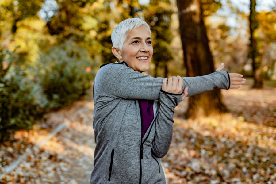 senior woman stretching her arms